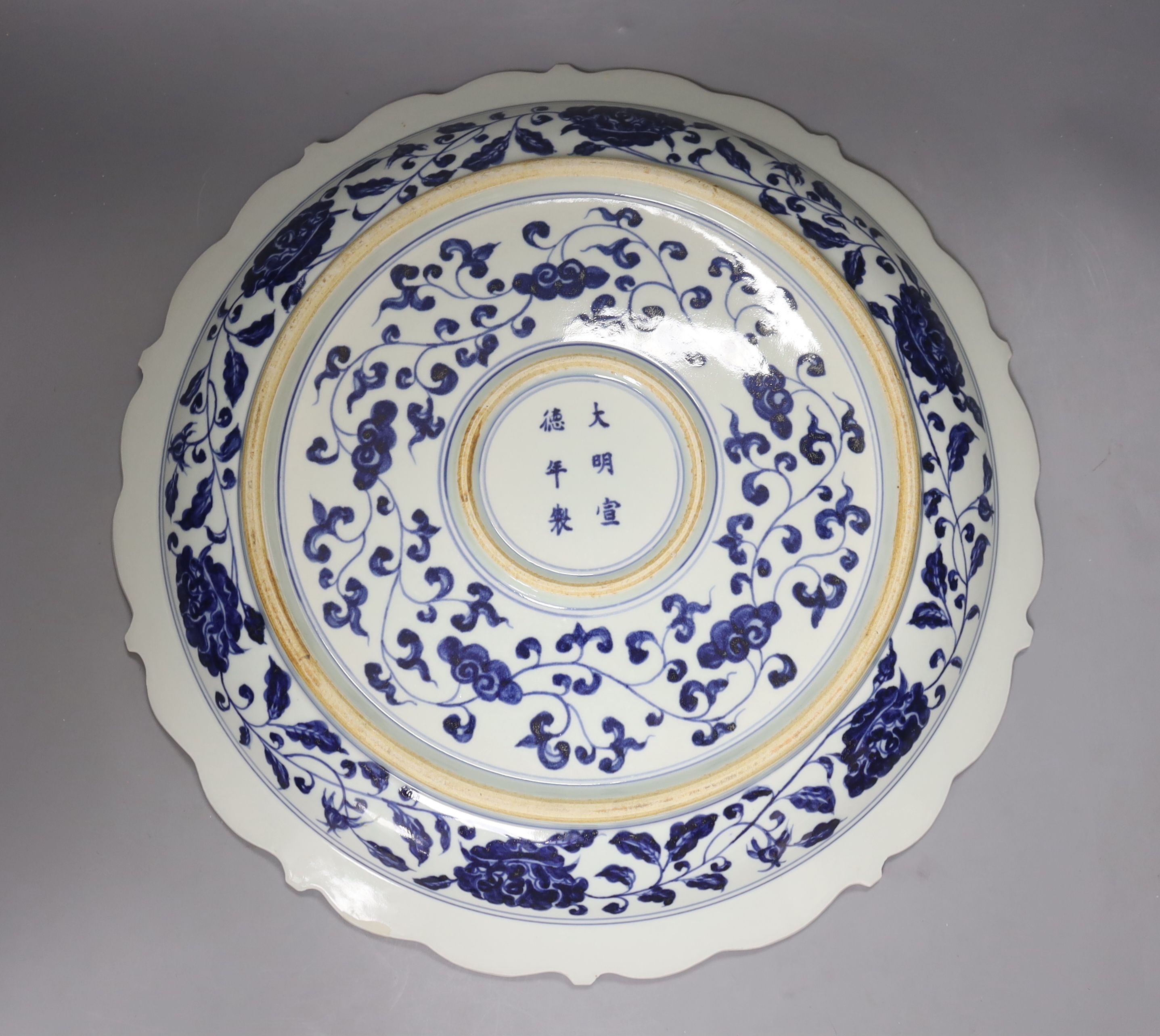 A Chinese blue and white Ming style dragon and phoenix dish, diameter 40cm